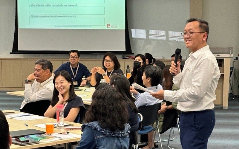 man presenting at a training for employees